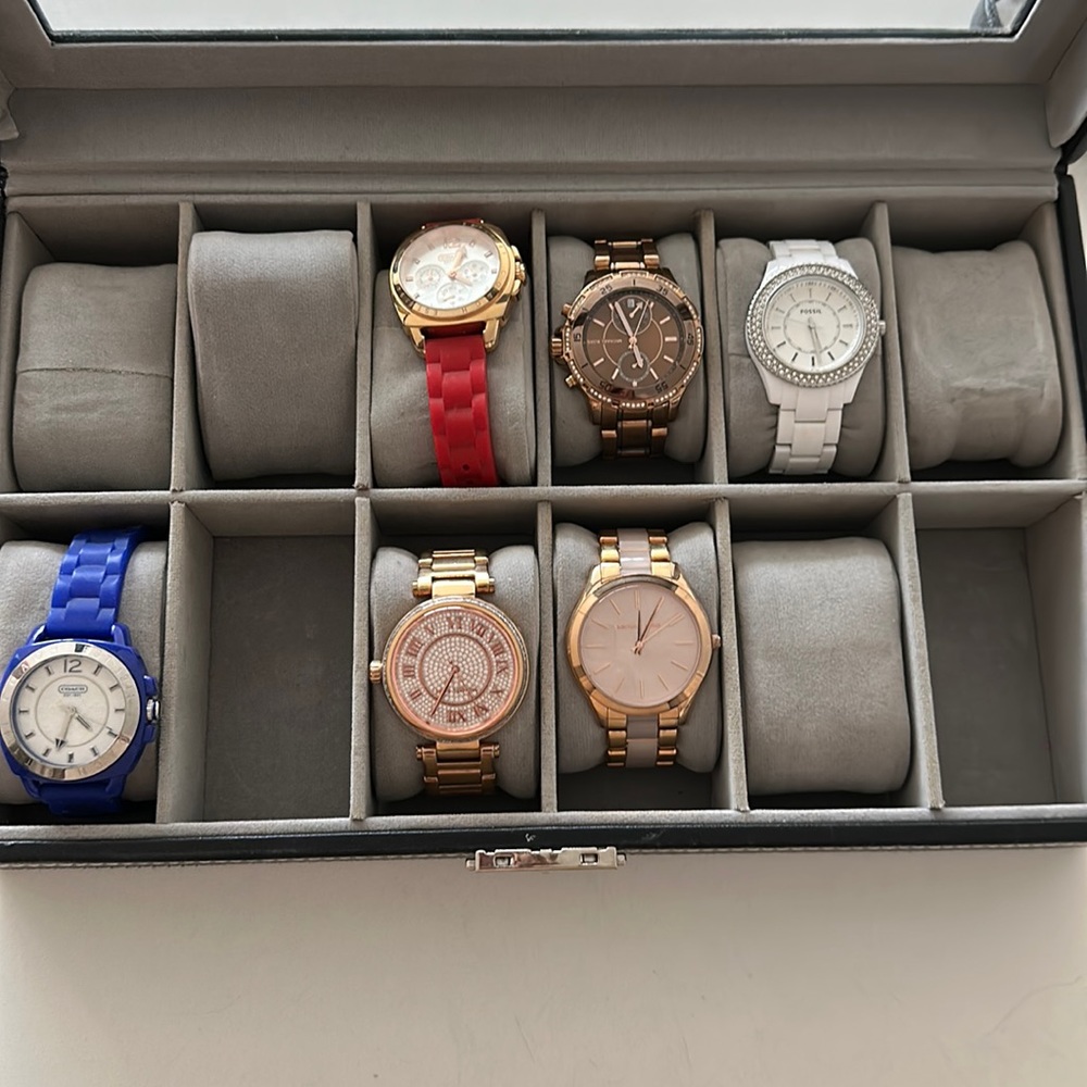 Coach (blu and red), Michael Kors (rose golds), and Fossil (white) watches